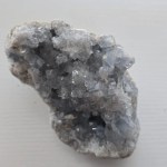 Close-up of a Celestite Crystal Geode showcasing soft sky-blue hues and natural textures