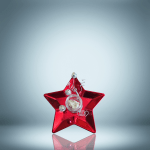 A beautifully arranged holiday gift set featuring muscovite crystals and festive star-themed decorations