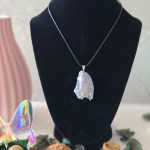 A rough kyanite pendant with a sturdy bail, displayed on a white background.