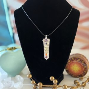 A stunning rose quartz chakra necklace displayed on a black velvet display featuring a 22-inch Korean Wax Black Cord