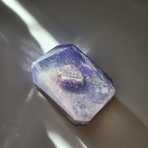 A mystical and luxurious crystal bar soap with an amethyst stone, offering mystical and enlightening properties