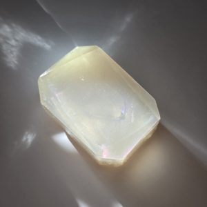 A luxurious crystal bar soap with a clear quartz stone, offering spiritual clarity and enlightenment properties.