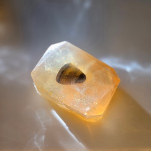 A luxurious crystal bar soap with a tiger's eye stone, offering strength and confidence-boosting properties.
