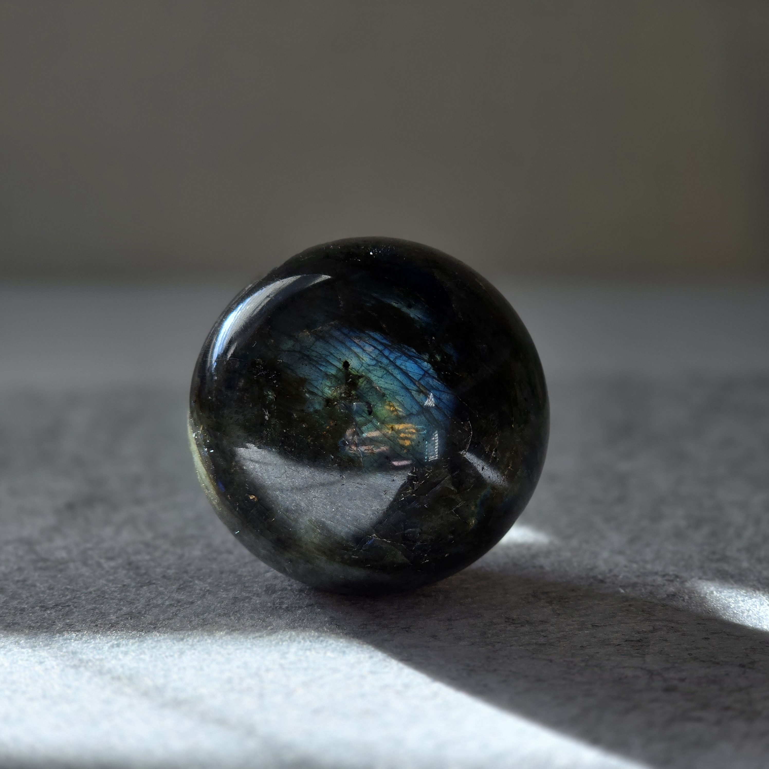 Galactic Radiance Labradorite Sphere - Front View showcasing iridescent colors