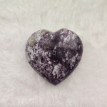Ethically sourced Lepidolite & Rubellite heart-shaped stone showcasing its distinctive purple and white hues on a neutral background