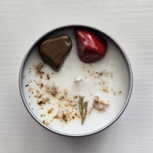 Sacred Space Crystal Candle - Top view showcasing Walnut Jasper and Red Jasper crystals with botanical elements.