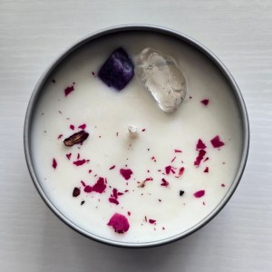 Top view showcasing embedded crystals, botanicals, and wax details