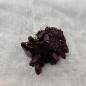 Close-up of a vibrant Red Quartz Cluster with deep red hues and striking crystalline formations