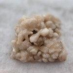 Close-up of a stunning Peach Stilbite-Apophyllite Cluster showcasing delicate hues and intricate crystalline formations