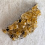 Close-up of a Citrine Crystal Cluster showcasing bright yellow facets and natural crystalline formations
