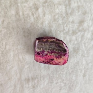 Close-up of a Pink Agate Crystal Geode with drusy, showing natural layered structure and shimmering drusy details.