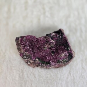 A vibrant Cobalt Calcite and Malachite mineral specimen with deep magenta and green hues, showcasing a raw and natural crystalline formation.
