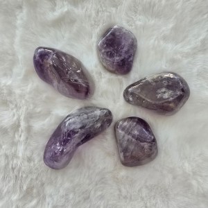 A soothing tumbled stone that promotes harmony, intuition, and emotional healing.