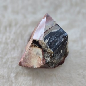 Ethically sourced Indian Turquoise point featuring a captivating pink-blue hue with vivid accents and a sharp carved tip